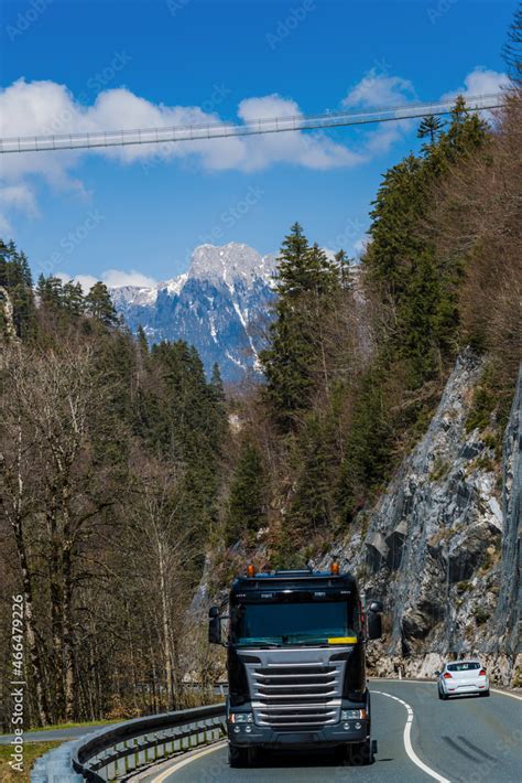 pedestrian suspension bridge crosses valley and road Stock Photo ...