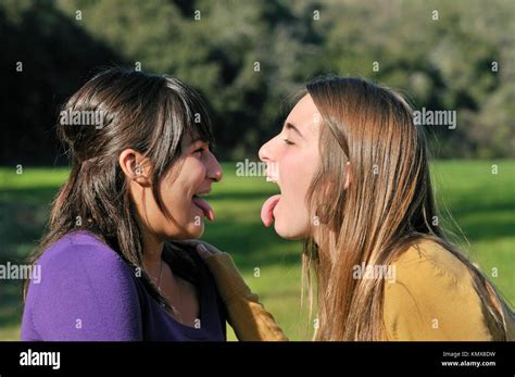 Two Teenage Girls Out There Tongues Stock Photo Alamy