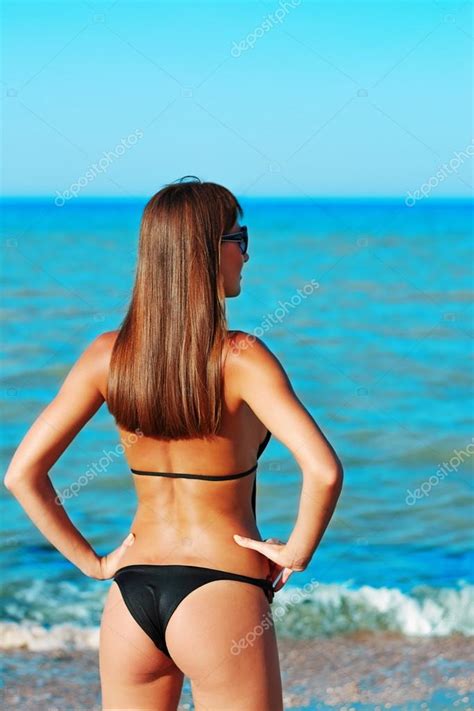Sexy Back Of A Beautiful Woman In Bikini On Sea Backgroun Stock Photo