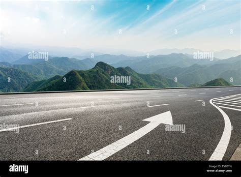 Empty Asphalt Road And Mountains With Beautiful Clouds Landscape Stock