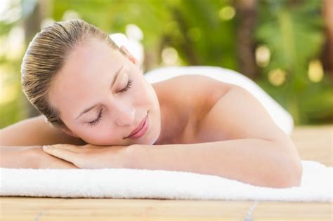 Premium Photo Peaceful Blonde Lying On Towel