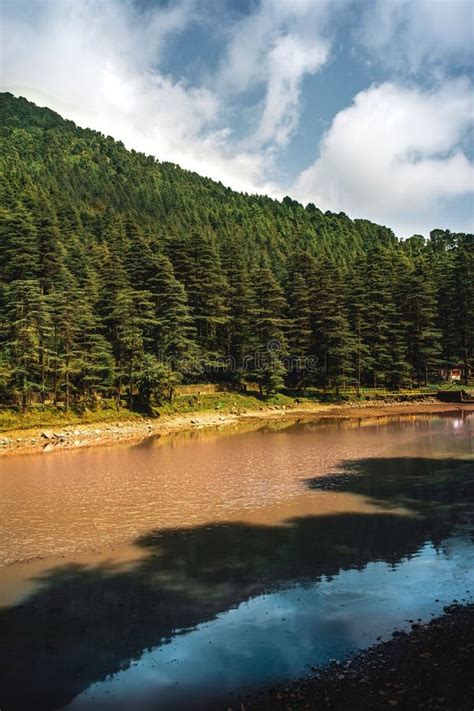 Dal Lake With Dense Green Mountain Forest In The Background In Himachal