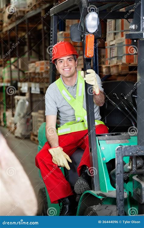 Foreman Sitting In Forklift At Warehouse Stock Photo Image Of Glove