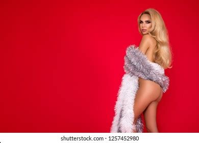 Sexy Naked Blonde Model Wearing Christmas Stock Photo