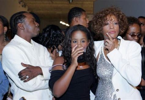 Bobby Brown, Whitney Houston and their daughter Bobbi Kristina watch ...