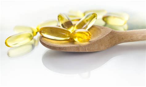 Fish oil capsules stock image. Image of remedy, leaf - 106361543