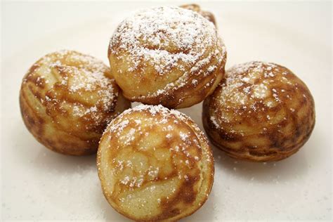 This is "Æbleskiver". A Danish Speciality Eaten At Christmas time. It's like a "pancake-ball ...