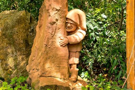 Premium Photo | Statue of a gnome in the forest sculpture garden in brazil