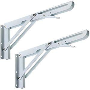 Two White Metal Brackets On A White Background