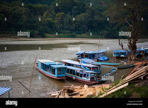 Boats by the Nam Ou river, Laos Stock Photo - Alamy