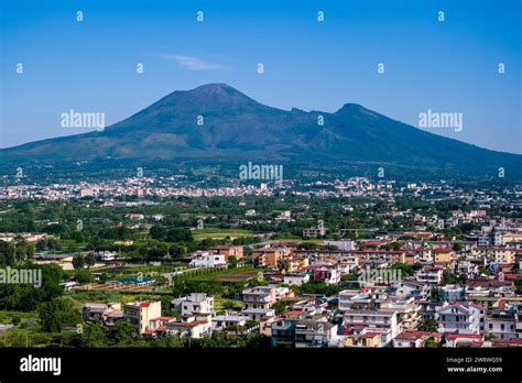 Aerial view of the buildings of the town Pompeii and the volcano Mount ...