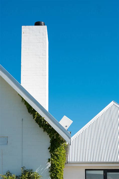 Detail Of Pitched Roof And Chimney Of Modern Farmhouse Design Del