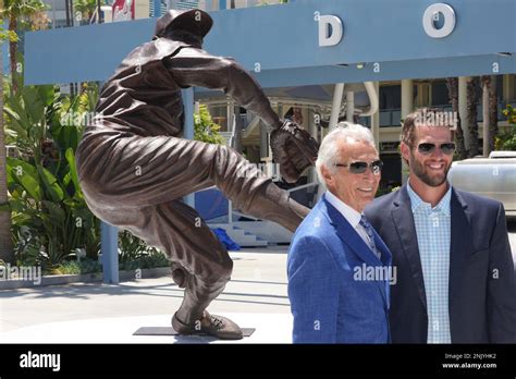 Former Brooklyn And Los Angeles Dodgers Pitcher Sandy Koufax Left And Dodgers Pitcher Clayton