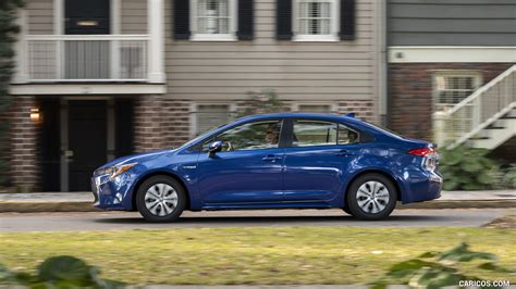 2020 Toyota Corolla Hybrid LE (Color: Blue Crush Metallic) - Side | Caricos