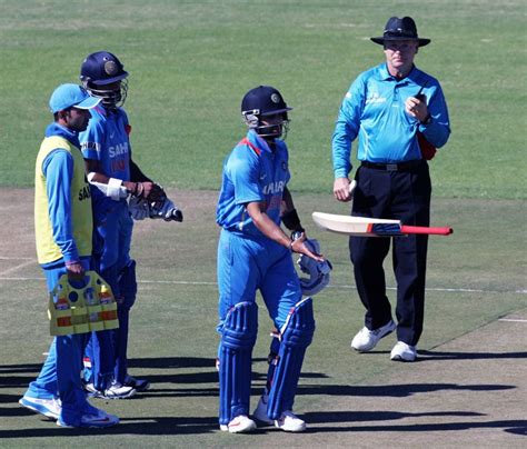 Virat Kohli tosses his bat in disappointment after being given out ...