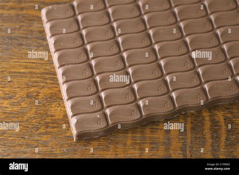 An Unwrapped Galaxy Chocolate Bar On An Oak Wood Table Stock Photo Alamy