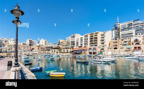 Hotels And Restaurants Line Spinola Bay In The Sliema Area On The