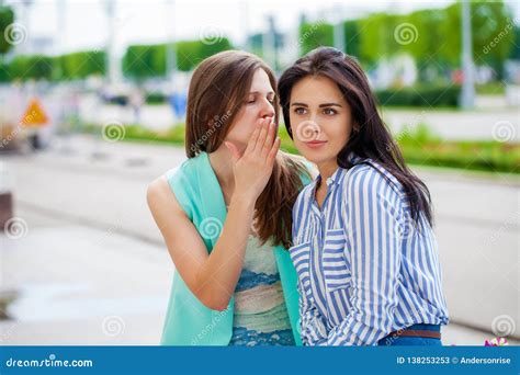 Two Young Women Talking To Each Other Stock Image Image Of