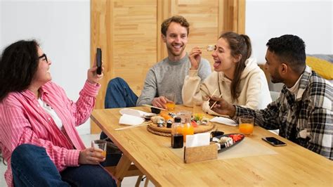 Free Photo | Friends eating sushi at home medium shot