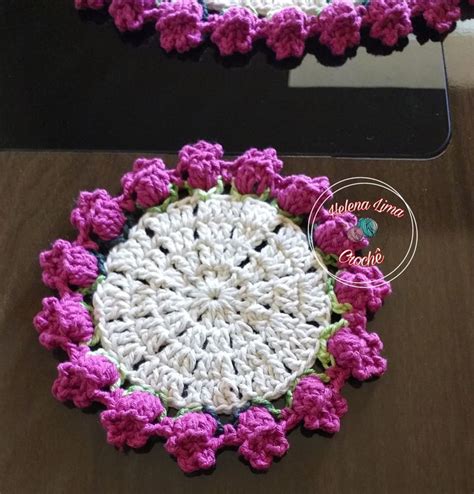 Two Crocheted Doily With Pink And White Flowers