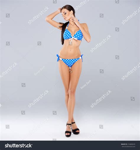 Sexy Brunette Posing Blue Swimsuit While Stock Photo 214808245 Shutterstock