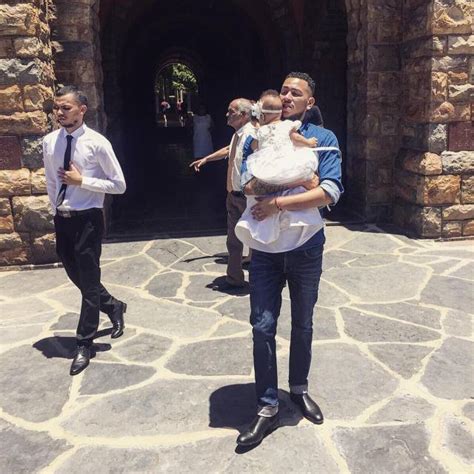 Picture Of The Day Rapper Aka Takes Daughter To Baptism