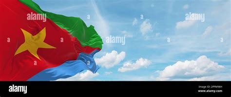 flag of Ethiopian Semitic peoples Tigrinyans at cloudy sky background ...