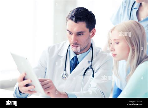 doctor and nurse with patient in hospital Stock Photo - Alamy