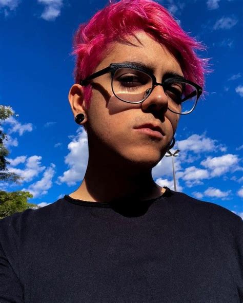 A Person With Pink Hair And Glasses On