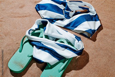 Flip Flops And Bikini On The Sand Stock Photo Adobe Stock
