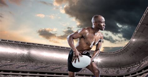 Composition Of Shirtless Male Rugby Player Holding Rugby Ball Over