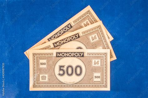 Monopoly money. Close up of a 500 on a blue background Stock Photo ...