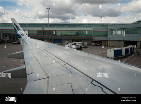 Westjet Airplane On The Runway At Toronto Pearson Airport Before Taking