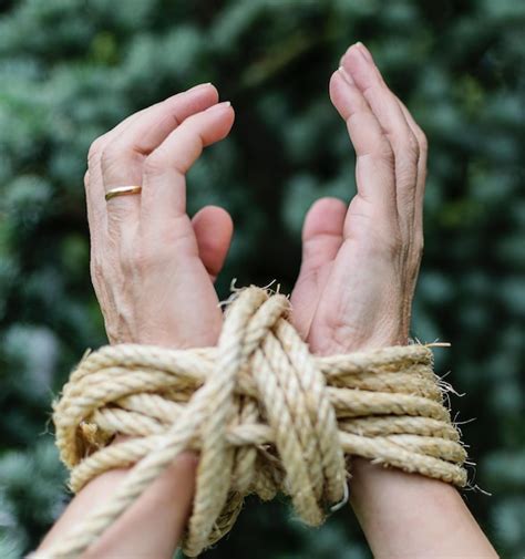 Premium Photo Cropped Hands Of Person Tied With Rope