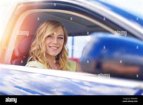 Beautiful Blonde Woman Driving A Car Stock Photo Alamy