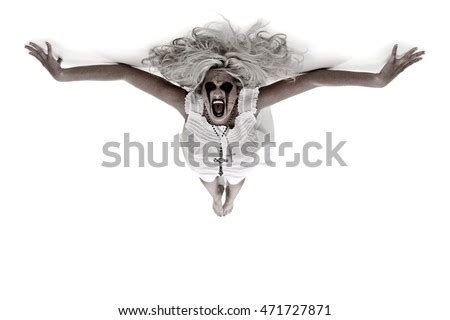 Possessed Woman Screaming Holding Creepy Doll Stock Photo