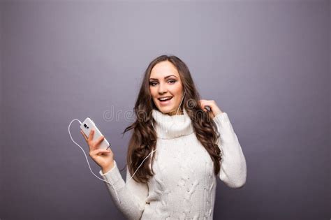 Woman Dancing To Music Listening To Phone With Earphones Stock Image