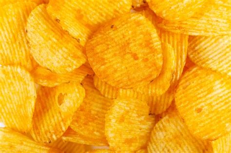 Premium Photo Crispy Potato Chips Close Up Snack Texture Background