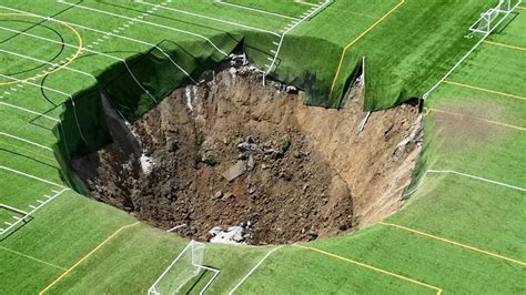 Giant Sinkhole Swallows The Center Of A Soccer Field Built On Top Of A