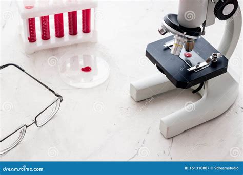 Blood Testing Laboratory Samples Viewing Under Microscope Near Tubes