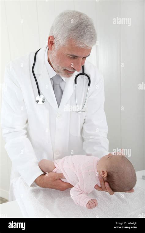 pediatrician examining babys good health stock photo alamy