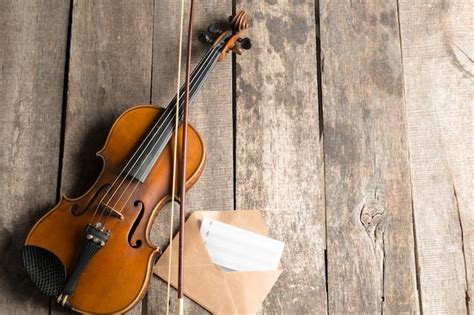 Premium Photo Sheet Music And Violin On Wooden Table