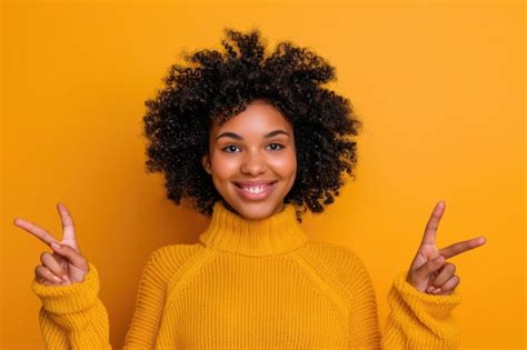 Premium Photo Portrait Of Attractive Happy Young Black Woman Pointing Fingers