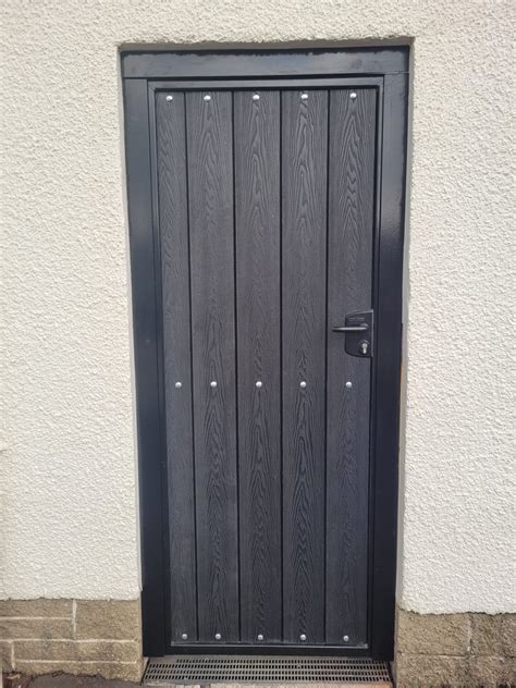 Composite Gate With Black Deep Embossed Boards Dain Art Iron