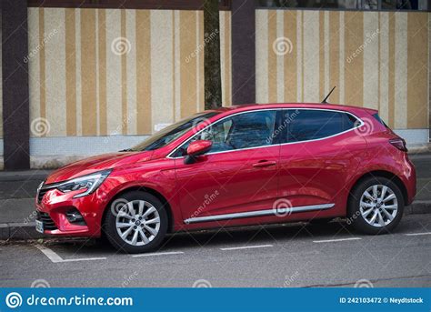 Profile View Of New Red Renault Clio Parked In The Street Editorial