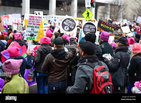 Large Crowd Of Protesters Many Wearing Pink Pussy Hats Holding Anti Trump Policy Signs In