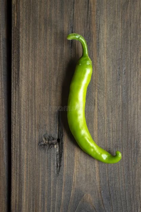 Green Chili Pepper Pod On A Wooden Table Green Pepper On The Table Green Chili Pepper Hot