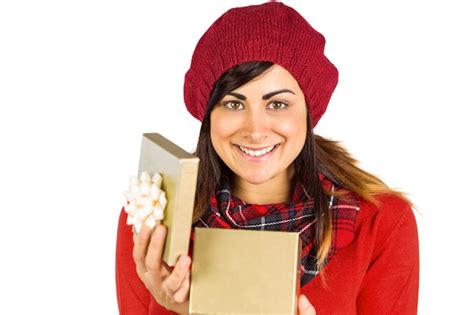 Premium Photo Smiling Brunette Opening Christmas Gift