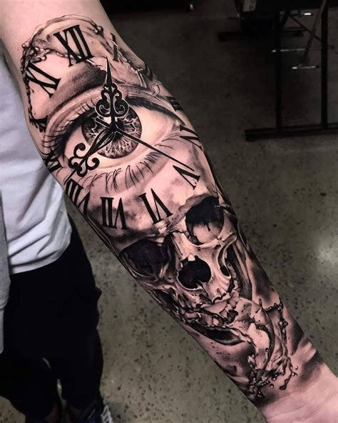 A Man With A Clock And Skull Tattoo On His Arm