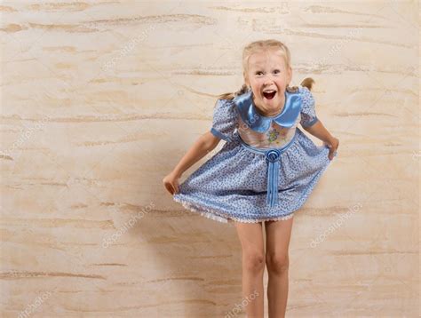 Laughing beautiful little girl taking a courtesy — Stock Photo ...